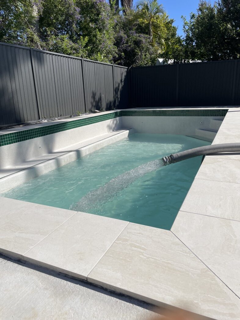 A swimming pool in Moreton Bay being filled with a clean, certified drinking water delivery